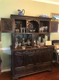 Continental heavily carved oak hutch, Waterford glasses and decanters, cut glass, silver bun warmers