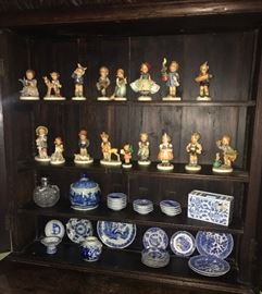 collection of Hummel figurines, blue & white porcelains, cut glass perfume bottle