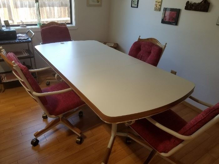 Retro Vintage Laminate Table with four Roller Chairs