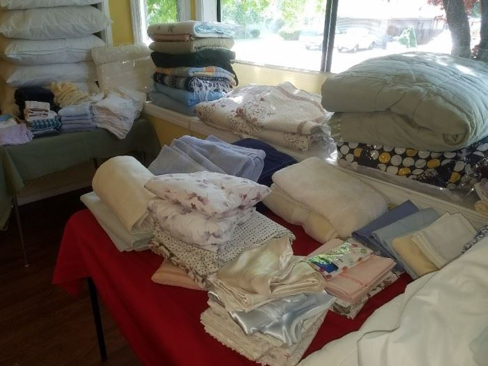 Lots of good linens, comforters, towels, sheets, doilies, blankets, pillows, etc. 
