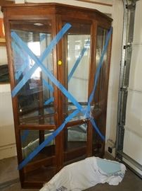 Beautiful although not in this photo...beautiful Curio Cabinet with Glass Shelves. We had it delivered and thus the blue tape.