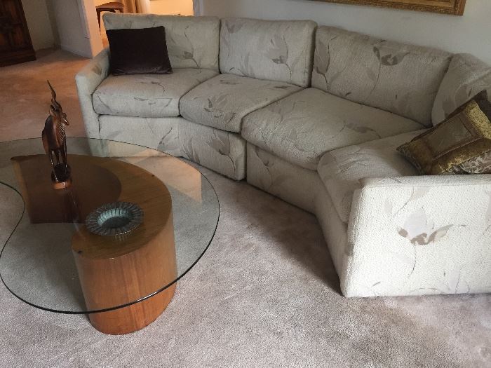 Sectional couch and modern coffee table with glass top