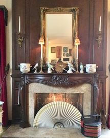 Gilt-Framed Mirror;  Mantle holds Brass Candlestick Lamps with Paper Shades, AR Jardiniere, Chinese Parrot, Italian Birds, Fan with Carved Bone Handle; Chinese Wedding Basket