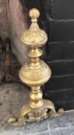 Ornate etched/scrolled pair of andirons with warm brass patina. 
