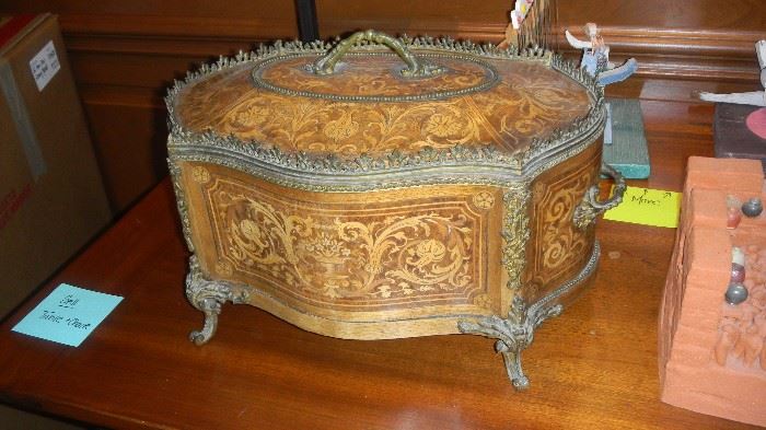 carved wooden box with metal trim
