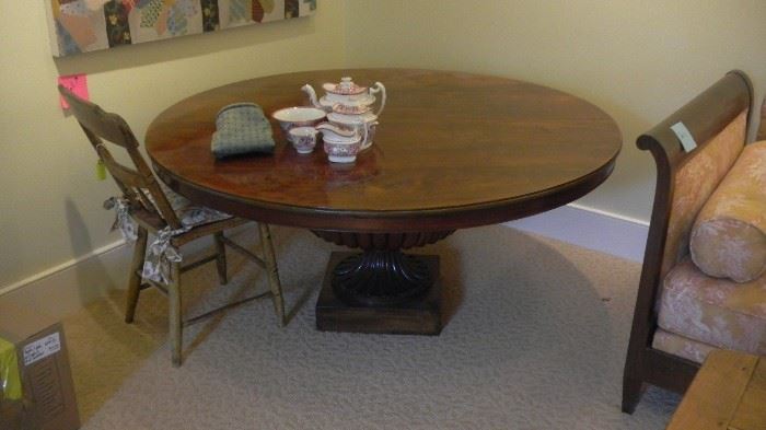 round coffee table, low to ground. comes with side extensions which screw on at bottom