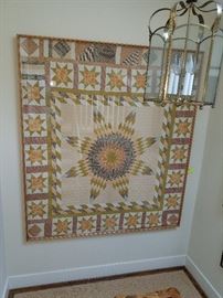 large, framed quilt