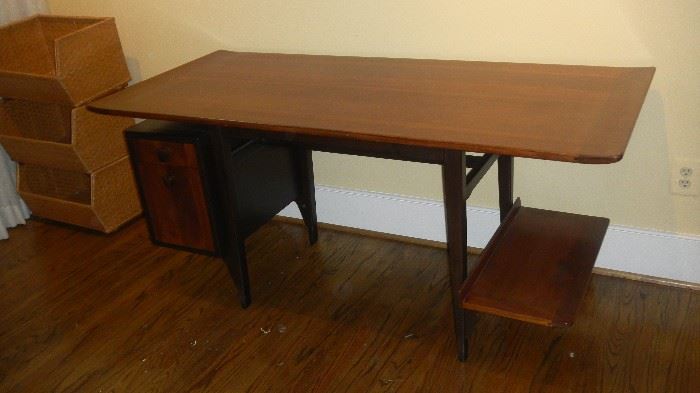 mid century modern desk, beautiful finish, slight curve on top edges. By Dunbar (there is a reserve on this desk, expensive)