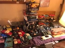 piles of collector cars and motorcycles 