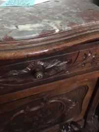 Detail of marble top and carvings of a pair of French Provincial end tables with drawer & door & porcelain enamel lining inside