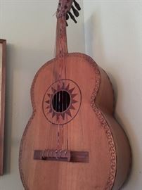 Front view of rustic, hand-made bass guitarron (maker mark not visible inside or outside)