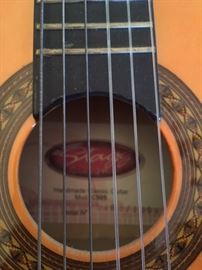 Detail of sound hole of smaller guitar