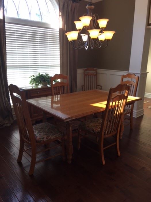 Dining table with 6 chairs (includes pads for the top of table )