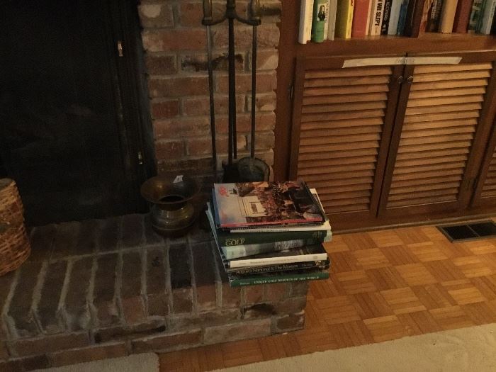 More books, fireplace tools in Den