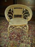 Heywood Wakefield early wicker chair. Has plaque on rear of seat.