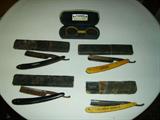 Four straight razors and a pair of glasses