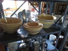 a slice of the kitchen and its goodies- several sets of nested stoneware mixing bowls, other pieces. plus sooooo much kitchen goodies