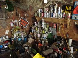 Beer can collection along with fishing tackle and traps