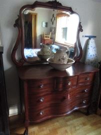 Beautiful serpentine front dresser with claw feet/ glass knob hardware, beveled mirror- very pretty dresser