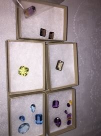 unset  Ametrine (25 carat stone),  40 carats of Amethysts and citrines, 47 carats of blue topaz, a 13 carat lemon topaz, 