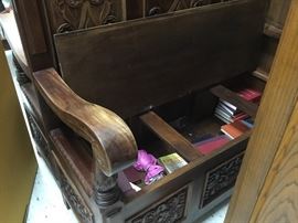 View of parson’s bench with seat open showing storage area 
