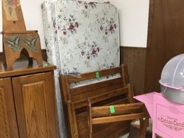 Twin bed mattress and box spring - headboard & footboard - also oak quilt rack in front of the bed
