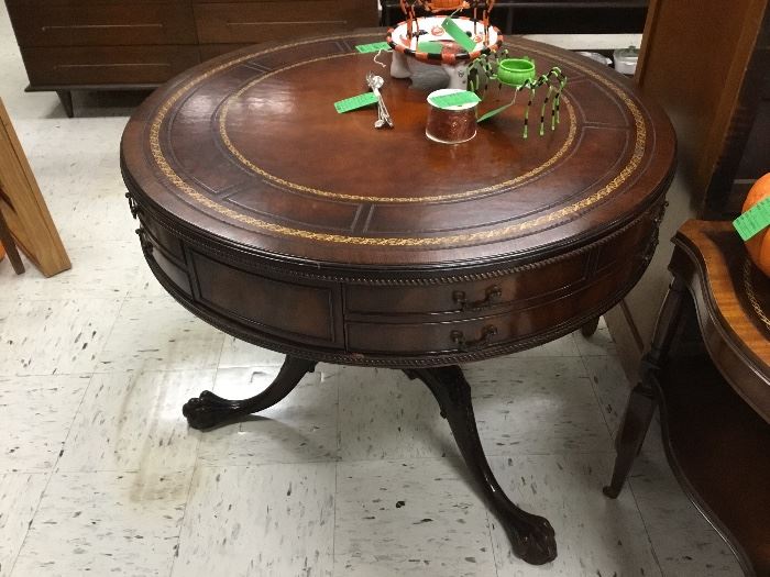 Beautiful drum table with carved legs and leather top.  
