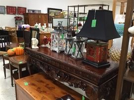 Large entry table, lamp and lanterns on the table 