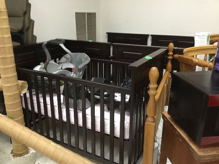 3 Black baby beds with mattress in each