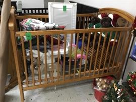 1 oak baby bed with lots of other baby items