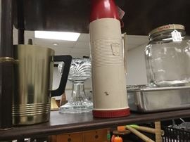 Metal,gold pitcher, large jar with lid and thermos. Aluminum sliding top cake pan/carrier