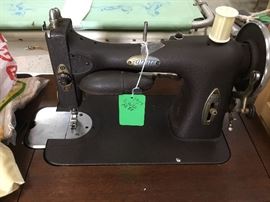 Close up of 1927 White Sewing machine and comes with cabinet 