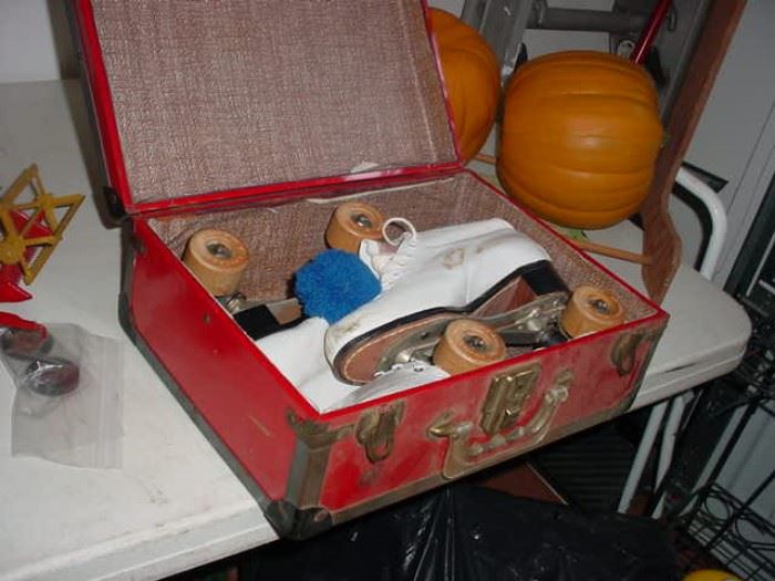 Suitcase with a pair of early roller skates