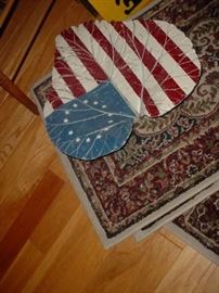 Cast tractor seat painted with flag