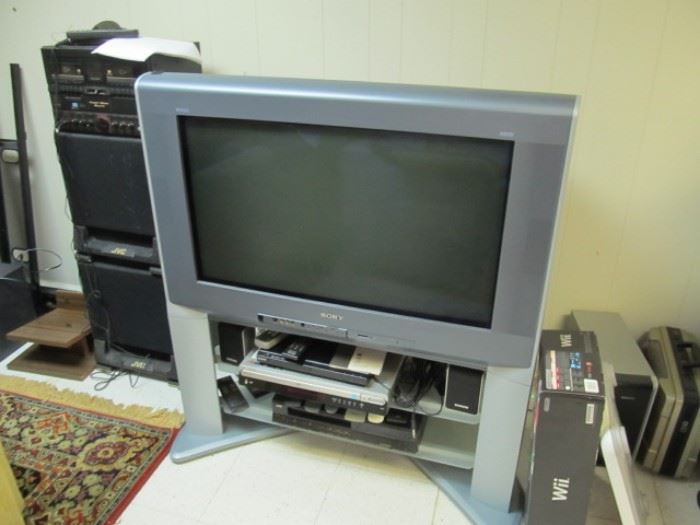 Sony HDTV with built in stand.  JVC Karaoke machine, Wii, 