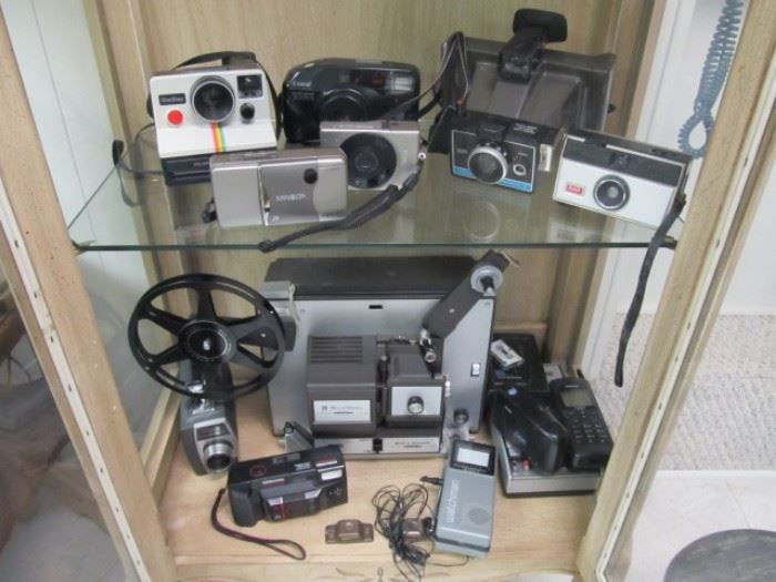 Bell and Howell projector, movie camera, and other still cameras