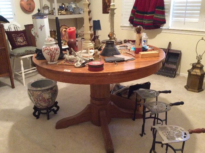round oak pedestal table, iron stands, patterns craft