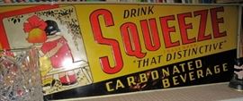 Squeeze soda sign.