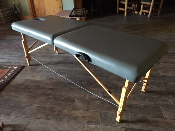 Folding massage table