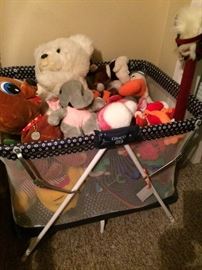 Playpen and lots of stuffed babies