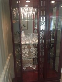 China Hutch with Waterford glassware:  champagne flutes, decanter, low-ball and wine glasses, water pitchers