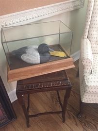 Side table with Decoy in Framed acrylic box and side arm chair