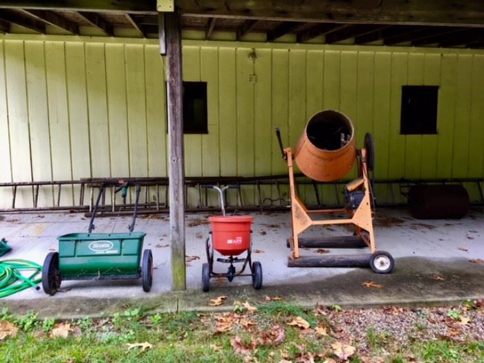 Lawn Spreaders, Motorized Cement Mixer, Wood Ladders in the Background