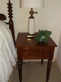 One of two cherry bedside tables