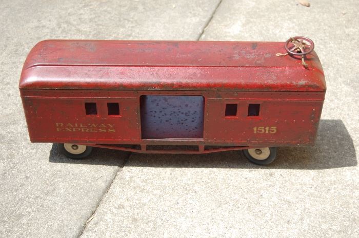 Antique train car, ride on and has steering wheel