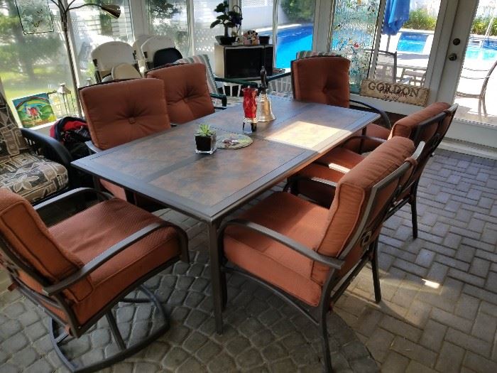 Beautiful patio set like new kept indoors.  Lots of other patio furniture and accessories at the sale.