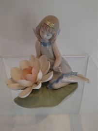 Lladro sitting girl with porcelain flowers