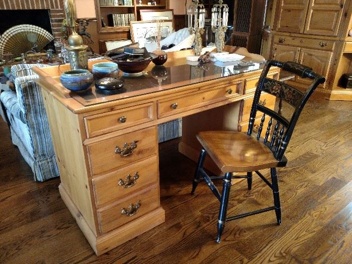 Pine kneehole desk with one of four Hitchcock chairs
