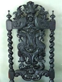 Close up of the back of the chair showing the opposing dragons
