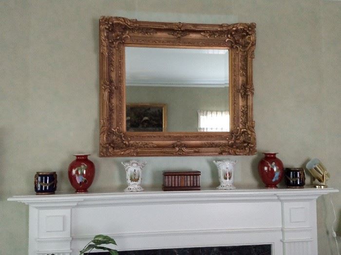 Gilt framed mirror over mantle with a pair of Chinese vase and other items previously photographed